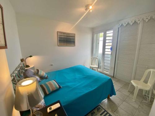 En eller flere senge i et værelse på Baie des Tropiques