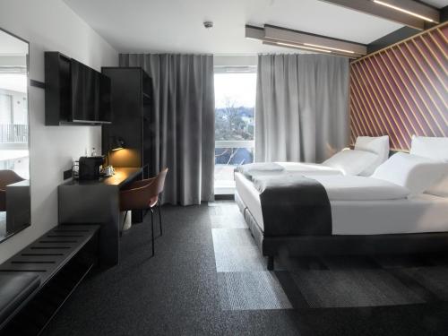 Postel nebo postele na pokoji v ubytování B&B Hotel Bad Homburg