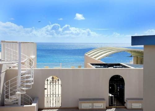 a view of the ocean from a building at Oceanfront Paradise: Penthouse with Peloton in Lowlands