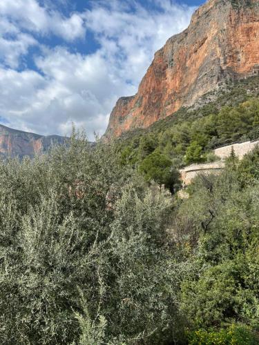 a view of a canyon with trees and a mountain at Sunshine 2 in Leonidion