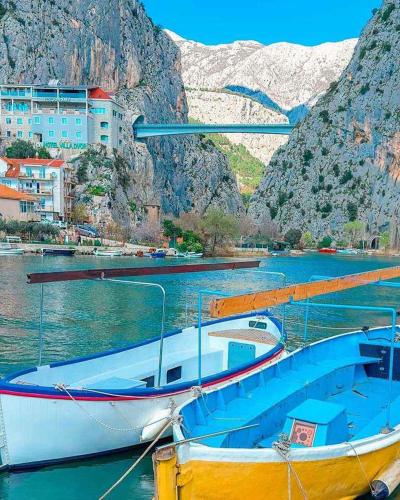 a boat is docked in a body of water at Apartment Mimice 1 in Mimice