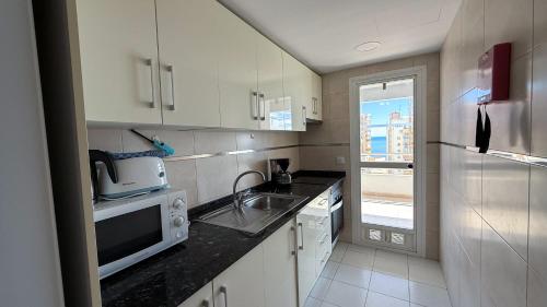 Una cocina o zona de cocina en Apartamentos Esmeralda Unitursa