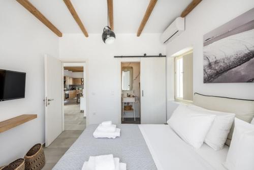 Ένα ή περισσότερα κρεβάτια σε δωμάτιο στο Aeon Villa