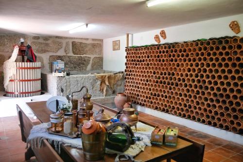 a room with a table with tea pots on it at Quinta de Fornelo - Família Campos in Amarante