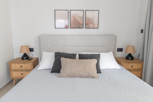 a bedroom with a large bed with two night stands at Callas Home in Kos