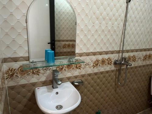 a bathroom with a sink and a mirror at Công Thành Hotel in Lao Cai