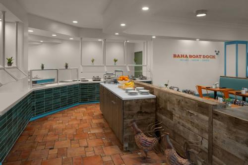 a kitchen with chickens standing in the middle of it at Marriott Hutchinson Island Beach Resort, Golf & Marina in Stuart