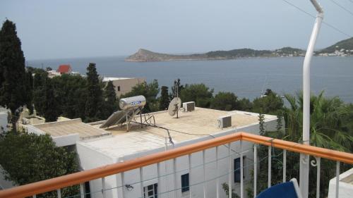 a view of the ocean from a balcony of a building at Tatsis Apartments in Masouri