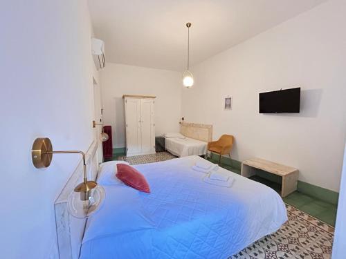 TV a/nebo společenská místnost v ubytování Damasa Rooms