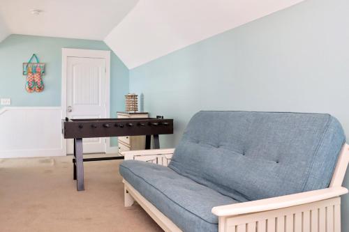 a living room with a couch and a piano at The Peaceful Pelican by Pristine Properties Vacation Rentals in Indian Pass