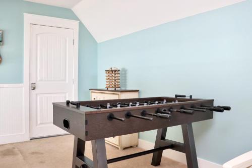 a wooden foosball table in a room at The Peaceful Pelican by Pristine Properties Vacation Rentals in Indian Pass