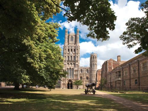 a view of a large building with a tower at Netherall Manor Lodge in Soham