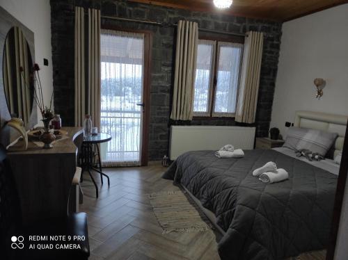 Postel nebo postele na pokoji v ubytování Bujtina Vila Dodo