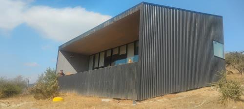 a black building on top of a hill at Bed&wine in Casablanca