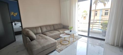 a living room with a couch and a table at Chambres d'Hôtes Centre Ville in Dakar