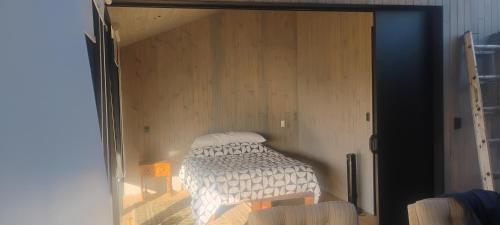 a bed is inside of a room with a glass door at Bed&wine in Casablanca