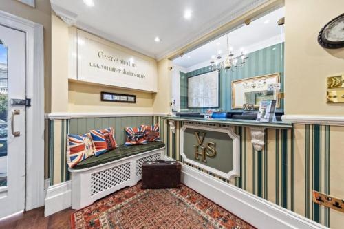 a lobby of a store with a counter at Vancouver Hotel and Studios in London