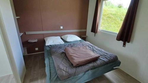 Ένα ή περισσότερα κρεβάτια σε δωμάτιο στο Camping 3 étoiles - Piscine - ccbadeg