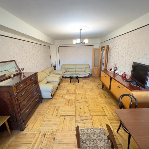 a living room with a couch and a tv at Mike in Yerevan