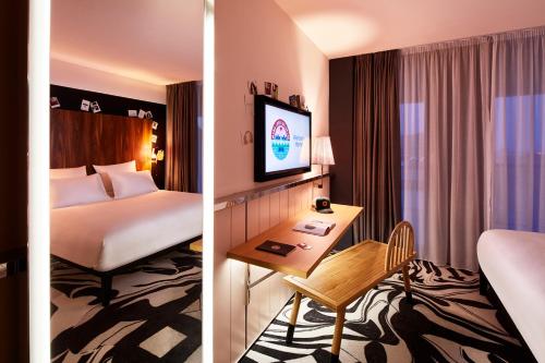 two pictures of a hotel room with a bed and a desk at Mama Shelter Belgrade in Belgrade