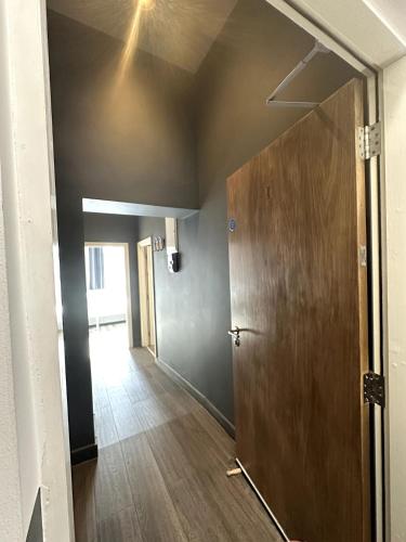 a hallway with a door and a ceiling at Abbey Apartments in Dublin
