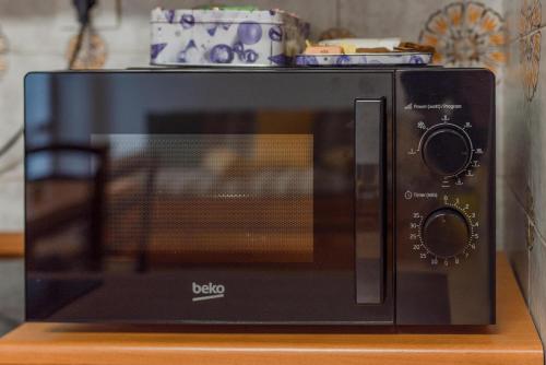 a black toaster oven sitting on top of a counter at The Valley Escape in Chiomonte
