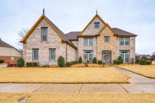 a house with two turrets at Family-Friendly Gem with Home Office in Memphis in Olive Branch