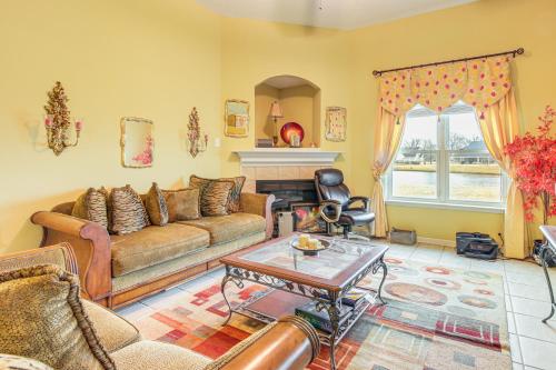 a living room with a couch and a table at Family-Friendly Gem with Home Office in Memphis in Olive Branch