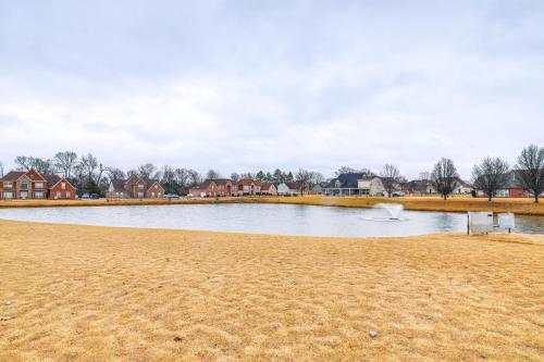 a river with houses in the background and a beach at Family-Friendly Gem with Home Office in Memphis in Olive Branch