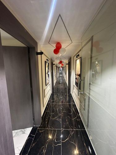 a hallway of a building with a hallwayngth at Hotel Shyam Paradise in Vadodara