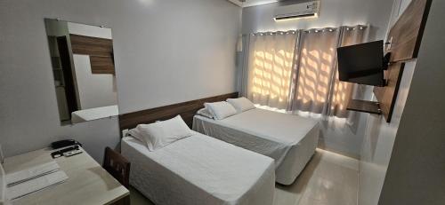 Katil atau katil-katil dalam bilik di Pumma Hotel Ourilândia