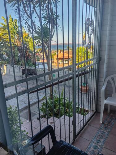 a room with a window with a view of the ocean at MayBach Hills Palace Guesthouse in Saldanha