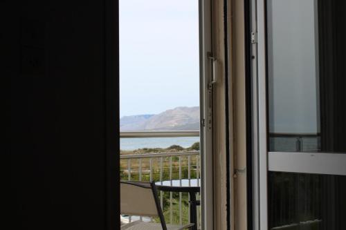 a room with a view of the ocean from a window at Sea Sight Vibes in Frangokastello