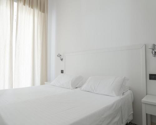 Hotel Venere Azzurraにあるベッド
