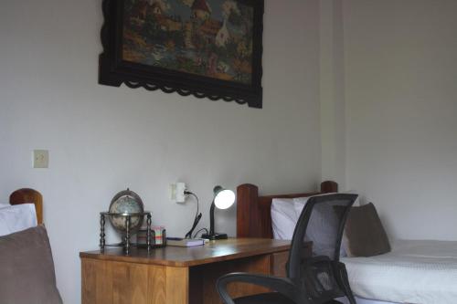 a bedroom with a desk and a bed and a desk at Sea Sight Vibes in Frangokastello