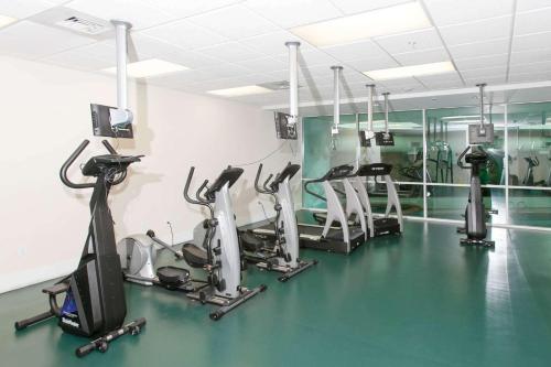 a gym with several treadmills and elliptical machines at Caribe D-0404 in Orange Beach