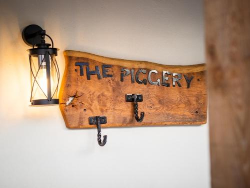 a sign that says the pierre hanging on a wall at The Nest Close to York with Hot Tub in Barmby on the Marsh