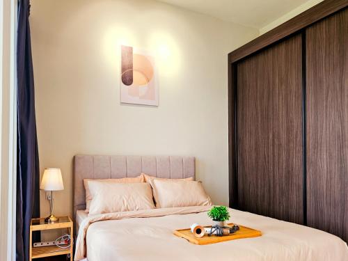 Ένα ή περισσότερα κρεβάτια σε δωμάτιο στο Beacon Executive Suite by NGN - Georgetown Penang