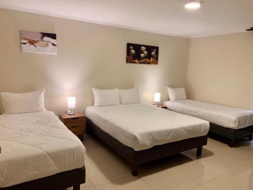 Cama o camas de una habitación en Península Hostel