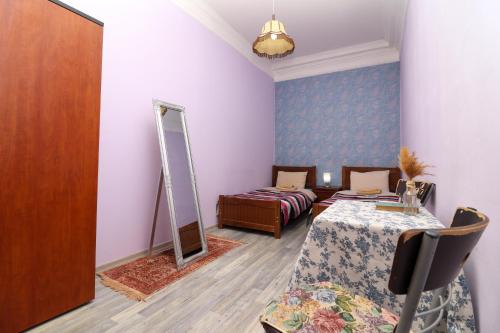 a dressing room with a table and a mirror at Leon Rooms in Tbilisi City