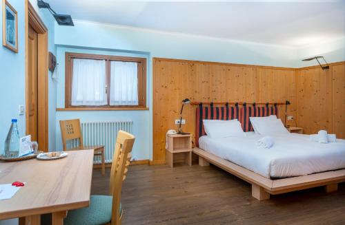 Postel nebo postele na pokoji v ubytování Valbruna Inn Bed & Breakfast