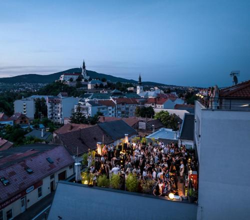 a group of people standing on top of a building at BOUTIQUE HOTEL11 with rooftop SPA in Nitra