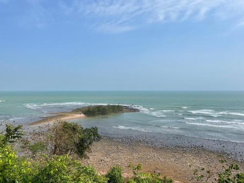 a view of a beach with the ocean at The Munique Cliff House Chumphon - private jacuzzi with beach views in Chumphon