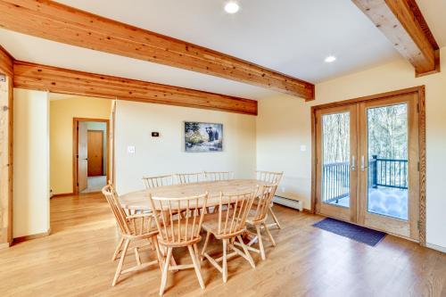 a dining room with a table and chairs at Golf, Fish and Ski Retreat with Game Room in Thompson in Thompson