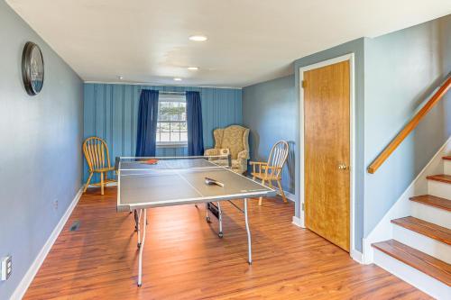 a dining room with a ping pong table in it at 3 Mi to Berkshire Mall Suburban Stay with Yard! in Sinking Spring