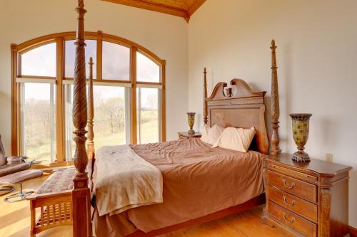 a bedroom with a bed and a dresser and a window at 366 Shared Acres, Lake Access: Ozark Getaway! in Fairfield Bay