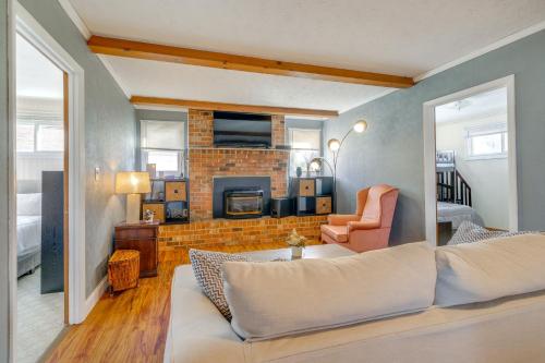 a living room with a couch and a fireplace at Lake Views and Private Dock Radford Retreat! in Radford