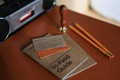 a piece of paper on a table with chopsticks at Cosy Off-Grid Cabin with Lake View Pet Friendly - Nikita in Rylstone