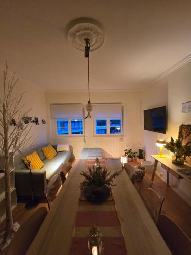 a living room with a couch and a table at Majesticlara Lisbon Guest House in Lisbon