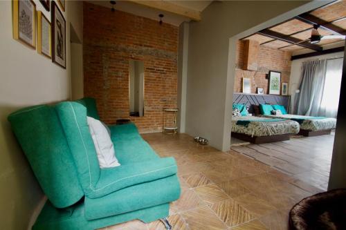 Ένα ή περισσότερα κρεβάτια σε δωμάτιο στο Hotel Boutique Santa Elena